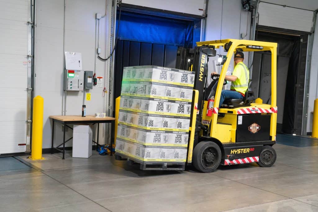 Physical Vs Digital: The Pros and Cons of Selling Each Online - Image credit - https://www.pexels.com/photo/man-riding-on-yellow-forklift-1267329/