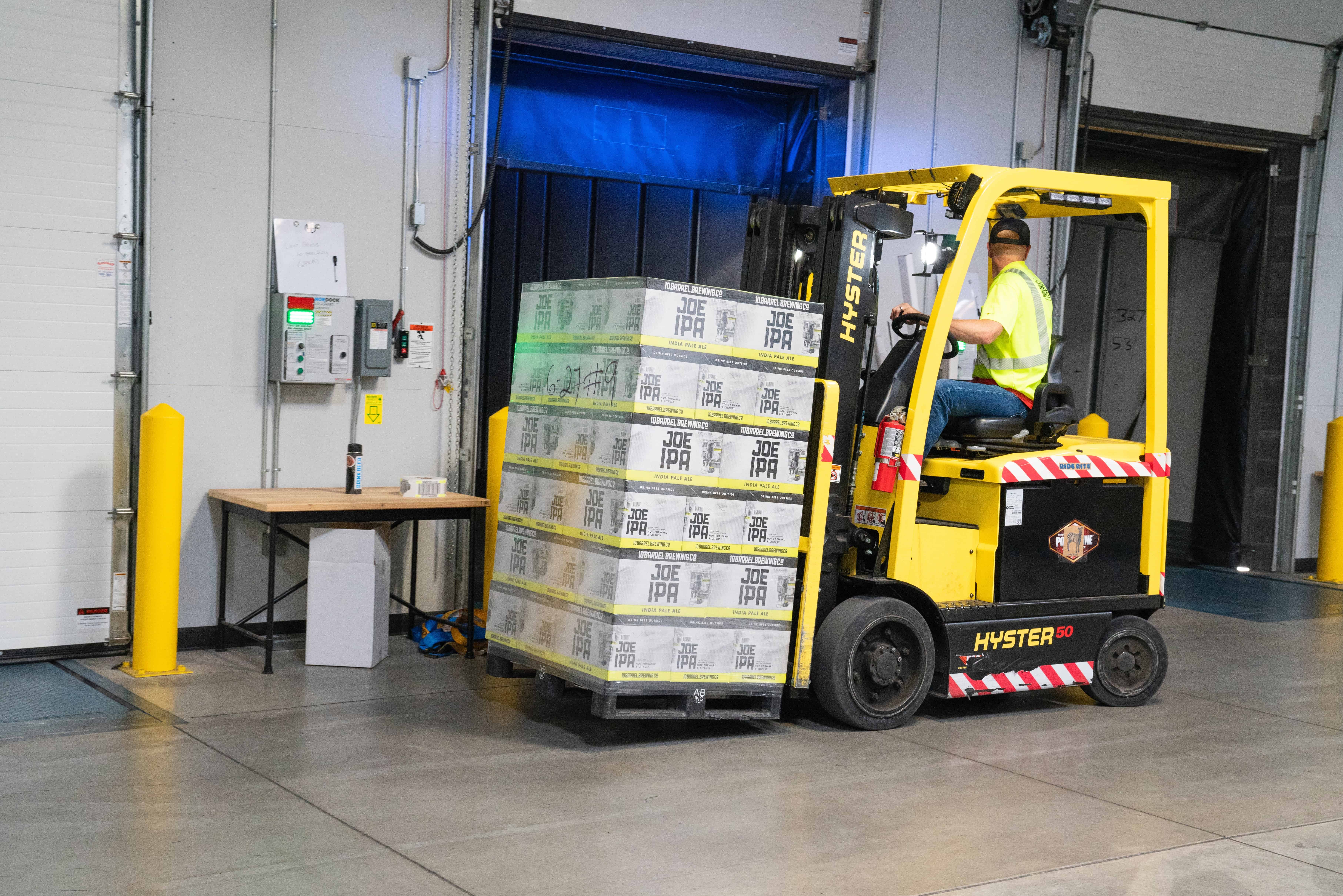 Physical Vs Digital: The Pros and Cons of Selling Each Online - Image credit - https://www.pexels.com/photo/man-riding-on-yellow-forklift-1267329/
