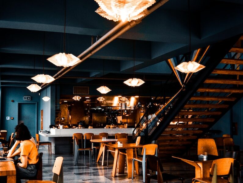 people sitting on chairs inside restaurant