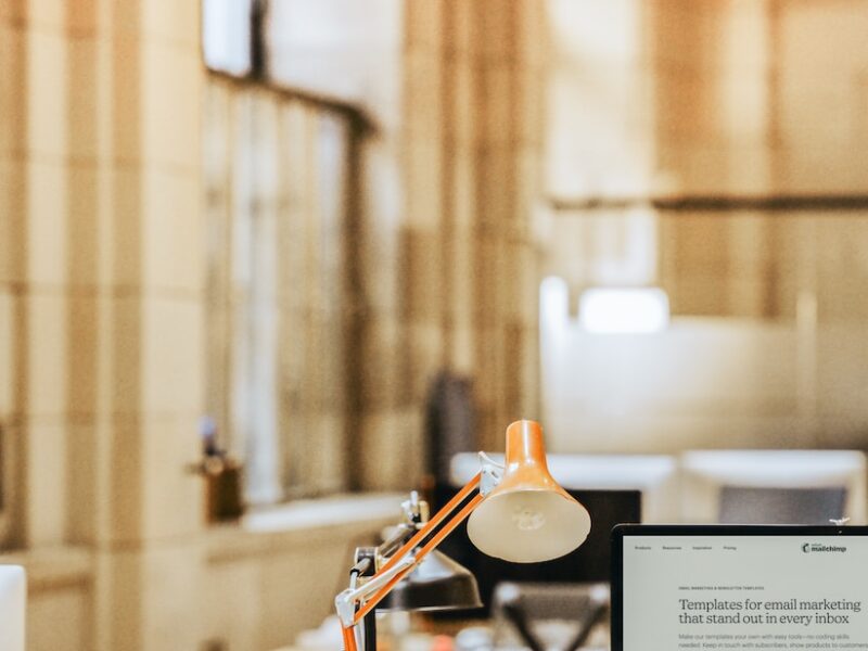 a desk with a lamp and a lamp on it