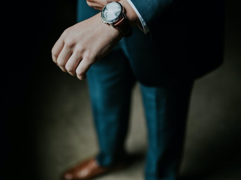 man holding his black suit