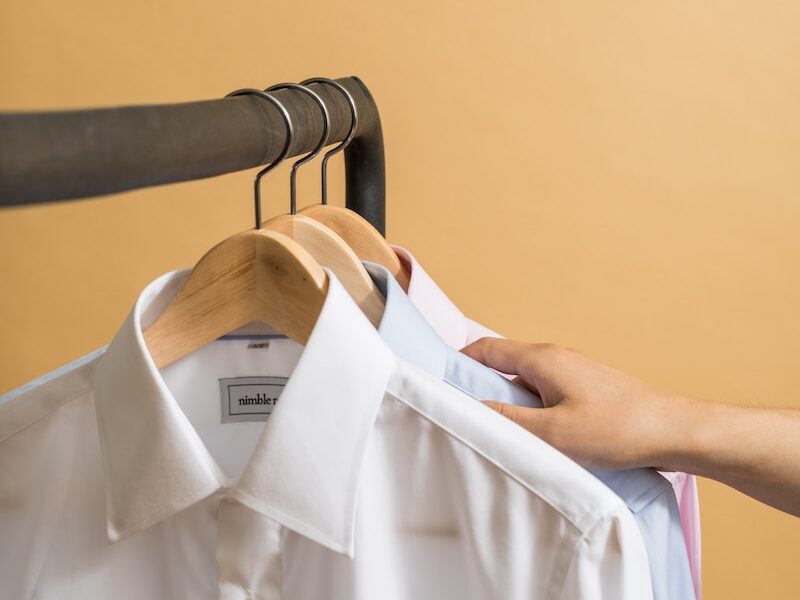 white button up shirt on clothes hanger