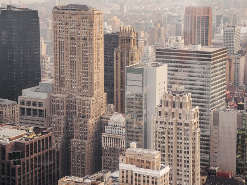 aerial view of city under cloudy sky during day time