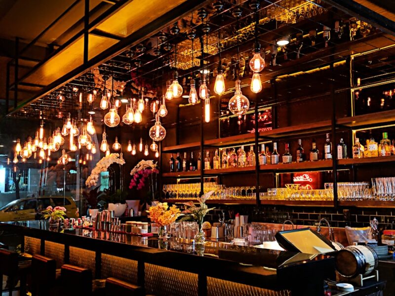 turned-on filament bulb lights at bar counter